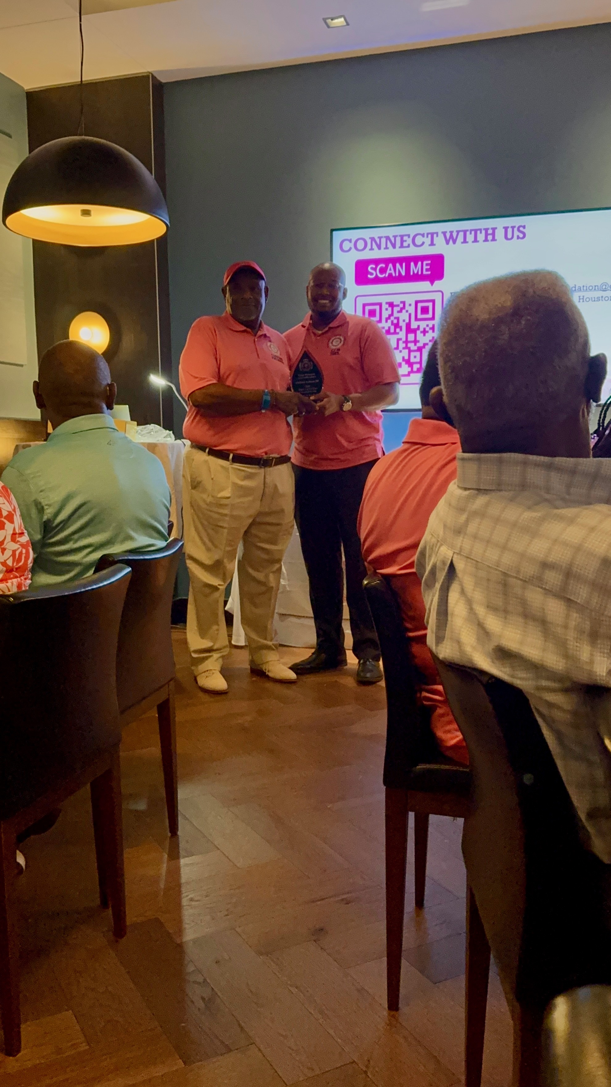 President Clifford Jackson Jr. presenting the Corine Thompson Award of Excellence to Treasurer Clifford Jackson III